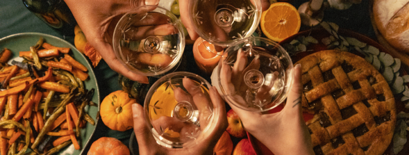 Four glasses of wine over thanksgiving table
