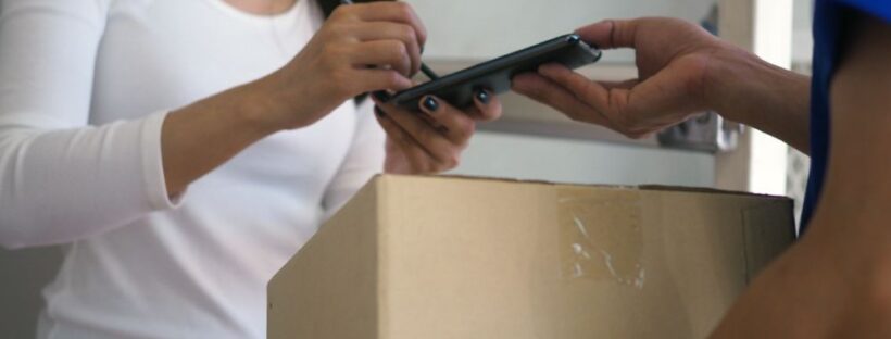Woman signing for package
